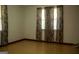 A bedroom with natural light, carpeted floors, and decorative window coverings at 123 Cowan Rd, Covington, GA 30016