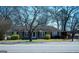Charming single-story home with a cozy front yard and covered carport at 123 Cowan Rd, Covington, GA 30016