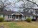 Attractive single-level home featuring classic shutters and welcoming entrance at 123 Cowan Rd, Covington, GA 30016