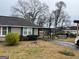 Charming single-story home featuring a cozy carport and well-maintained front yard at 123 Cowan Rd, Covington, GA 30016