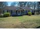 Lovely home featuring a well-maintained lawn and cozy front porch at 123 Cowan Rd, Covington, GA 30016