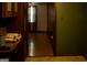 Hallway featuring classic wood details, a glimpse into an adjacent room and storage at 123 Cowan Rd, Covington, GA 30016