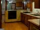 A kitchen offering vintage oven with a built-in stovetop and wood cabinets at 123 Cowan Rd, Covington, GA 30016