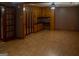 Spacious living room boasts ample storage with built-in cabinets and classic wood flooring at 123 Cowan Rd, Covington, GA 30016