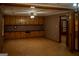 Expansive living area features built-in storage, wood flooring, and a ceiling fan at 123 Cowan Rd, Covington, GA 30016