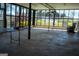 Well-lit sunroom with large windows offering views, a simple table, and furniture at 123 Cowan Rd, Covington, GA 30016