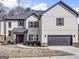 Beautiful new construction home featuring a stylish brick exterior and an attached garage at 209 Langshire Dr, Mcdonough, GA 30253