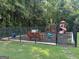 Neighborhood playground with a variety of play equipment and lush surroundings at 209 Langshire Dr, Mcdonough, GA 30253