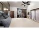 Tranquil main bedroom shows decorative wall trim and bathroom with sliding barn door at 1694 Mount Bethel Rd, Mcdonough, GA 30252