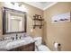 Powder room with granite countertop vanity, decor, and toilet at 3075 Wood Valley Dr, Mcdonough, GA 30253