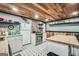 A rustic kitchen features a butcher block counter and white cabinetry at 3075 Wood Valley Dr, Mcdonough, GA 30253