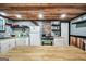 A charming kitchen features white cabinets and a butcher-block countertop at 3075 Wood Valley Dr, Mcdonough, GA 30253