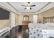 Relaxing main bedroom with dark hardwood floors, trey ceiling, and an en-suite bathroom at 3075 Wood Valley Dr, Mcdonough, GA 30253