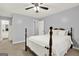 Bedroom featuring a wooden bed frame, white bedding, and light gray walls at 6255 James Rd, Austell, GA 30168