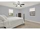 Serene bedroom features a ceiling fan and natural light at 6255 James Rd, Austell, GA 30168