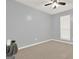 Bedroom featuring light gray walls, carpet flooring, and natural lighting at 6255 James Rd, Austell, GA 30168