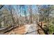Long driveway leading to the property provides privacy and seclusion among mature trees at 6255 James Rd, Austell, GA 30168