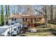 Charming exterior showcasing a cozy porch and well-kept landscaping at 6255 James Rd, Austell, GA 30168