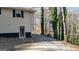Exterior side view of home with a door and some brick pavers at 6255 James Rd, Austell, GA 30168