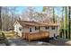 Charming home with a wooden deck and a well-maintained exterior at 6255 James Rd, Austell, GA 30168