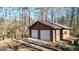 Detached garage with two-car parking and side door entry adds convenience and functionality at 6255 James Rd, Austell, GA 30168