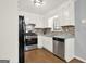 This kitchen has stainless steel appliances, sleek countertops, and ample cabinet space at 6255 James Rd, Austell, GA 30168