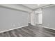 The living room features gray-toned walls, gray wood-look flooring, and a walk-in closet at 6255 James Rd, Austell, GA 30168