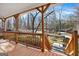 Expansive view from the porch showcasing the surrounding trees and a glimpse of neighborhood homes at 6255 James Rd, Austell, GA 30168