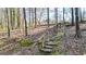 Stone staircase with wood railing, blending nature with comfort and functionality at 6255 James Rd, Austell, GA 30168