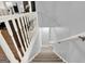 Staircase with carpeted steps and white railings at 6255 James Rd, Austell, GA 30168