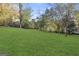 Expansive backyard with lush green lawn and mature trees, offering plenty of space for outdoor enjoyment at 2378 Green Forrest Dr, Decatur, GA 30032