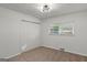 Bedroom features plush carpet, a window and large closet with bi-fold doors, and modern ceiling light at 2378 Green Forrest Dr, Decatur, GA 30032