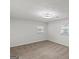 Neutral bedroom with plush carpet, two windows that provide ample natural light and a modern ceiling light at 2378 Green Forrest Dr, Decatur, GA 30032