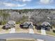 Aerial shot of a neighborhood showcasing three well-maintained homes with landscaped yards and driveways at 10736 Southwood Dr, Hampton, GA 30228