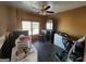 Secondary bedroom with fan, dresser, and tile flooring at 6160 Great Oaks Dr, Lithonia, GA 30058