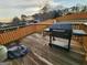 Back deck with a barbecue grill, wooden boards, and view of the neighborhood at 6160 Great Oaks Dr, Lithonia, GA 30058