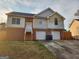 Two-story home with brick and siding, two-car garage, and a driveway at 6160 Great Oaks Dr, Lithonia, GA 30058