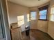 Well-lit room featuring neutral paint, hardwood floors, and multiple windows with blinds at 6160 Great Oaks Dr, Lithonia, GA 30058