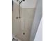 A standard stall shower with built-in seats and a shower head at 6160 Great Oaks Dr, Lithonia, GA 30058