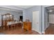 Elegant dining room featuring a large dining table, hardwood floors and a view of the living room at 275 Bramble Bush Trl, Covington, GA 30014