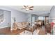 Bright living room with hardwood floors, an open floor plan, and neutral decor for a cozy feel at 275 Bramble Bush Trl, Covington, GA 30014