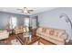 Well-lit living room with neutral walls, hardwood floors, comfortable seating and a welcoming atmosphere at 275 Bramble Bush Trl, Covington, GA 30014