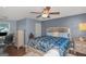 Comfortable main bedroom featuring a ceiling fan, hardwood floors and ample natural light at 275 Bramble Bush Trl, Covington, GA 30014