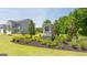 Stone entrance sign adorned with landscaping welcomes residents to a serene community with modern homes at 8595 Secretariat Dr # 19, Lithonia, GA 30058