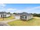 View of single-Gathering home with attached garage and neutral color palette at 8595 Secretariat Dr # 19, Lithonia, GA 30058