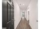 Entry way of the home with wood-look floors and a black front door at 8595 Secretariat Dr # 19, Lithonia, GA 30058