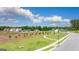 Street view showcasing a sidewalk winding through the community with well-manicured green spaces and newly built homes at 8595 Secretariat Dr # 19, Lithonia, GA 30058