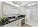 Bathroom featuring a vanity with a dark countertop and modern fixtures at 4569 Chatsworth Ovrlk Ne, Roswell, GA 30075