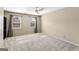 Spacious bedroom with neutral walls, carpeted flooring, and natural light from two windows at 4569 Chatsworth Ovrlk Ne, Roswell, GA 30075