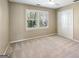 Cozy bedroom with natural light, closet, and neutral carpeted floors at 4569 Chatsworth Ovrlk Ne, Roswell, GA 30075